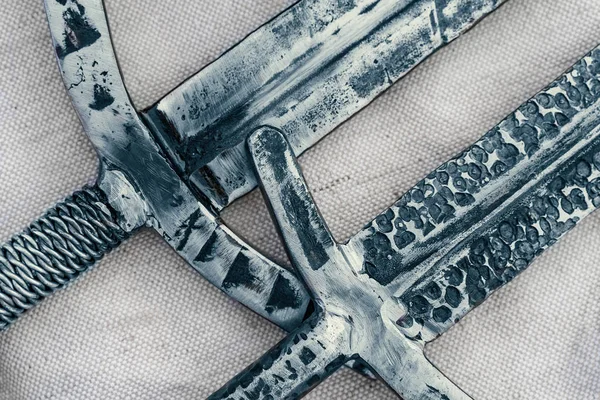 Ancient swords blades, antique steel cold weapon of knights or fantasy warriors, close up top view