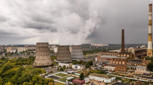 Aerial panorama of industrial area with smoke from chimneys of thermal power plant or station