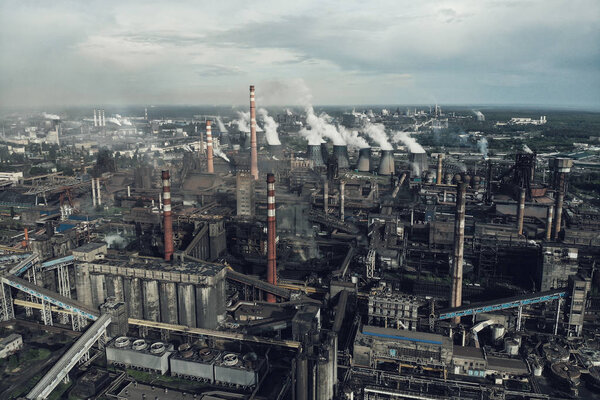 Heavy industry of Metallurgical Production industry landscape from drone. Smoke from chimneys, global warming concept, toned