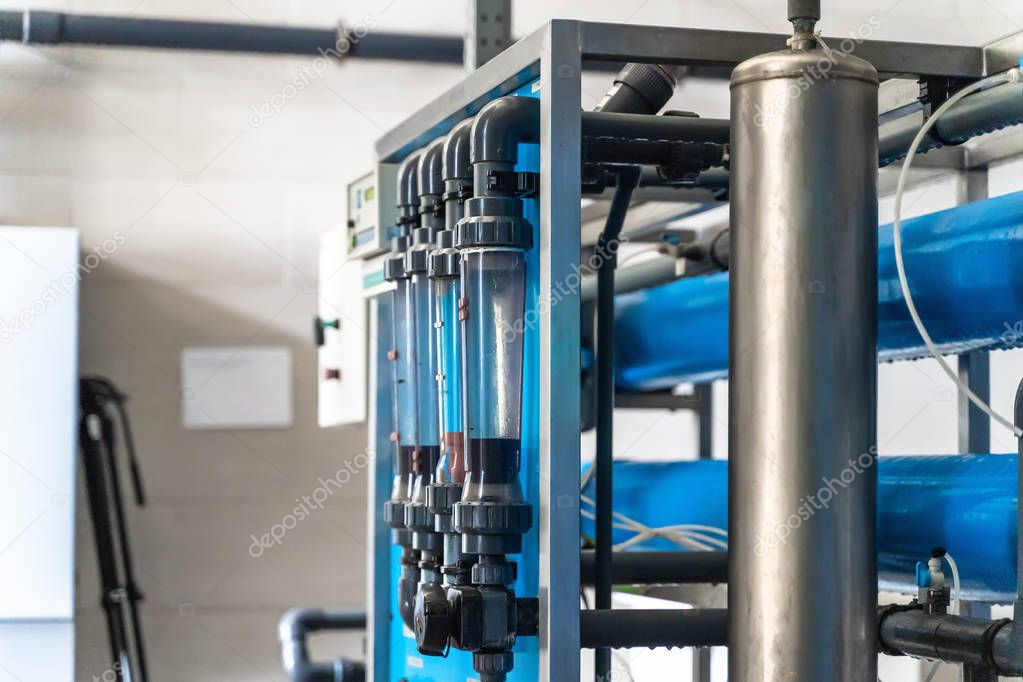 System of automatic treatment and multi-level filtration of drinking water produced from well. Plant or factory for production of purified drinking water