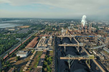 Aerial view of huge Metallurgical Plant, smokestacks and chimneys with smoke. Environmental pollution from petrochemical production industrial factory