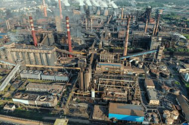 Aerial view of huge Metallurgical Plant, smokestacks and chimneys with smoke. Environmental pollution from petrochemical production industrial factory