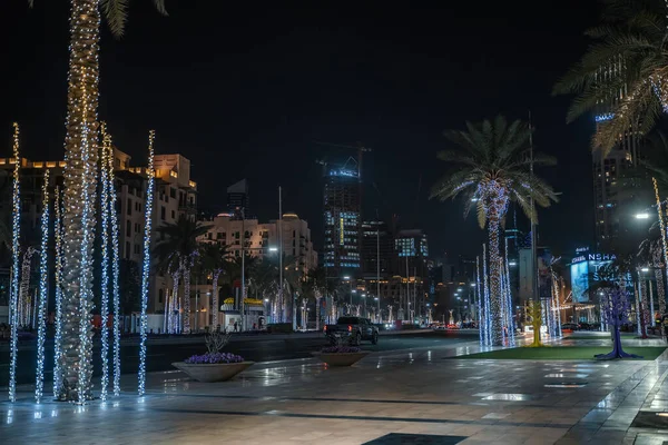 Dubai, UAE - February 2020 : Night view of Dubai city street downtown with cars, buildings and night illumination, UAE — Stock Photo, Image