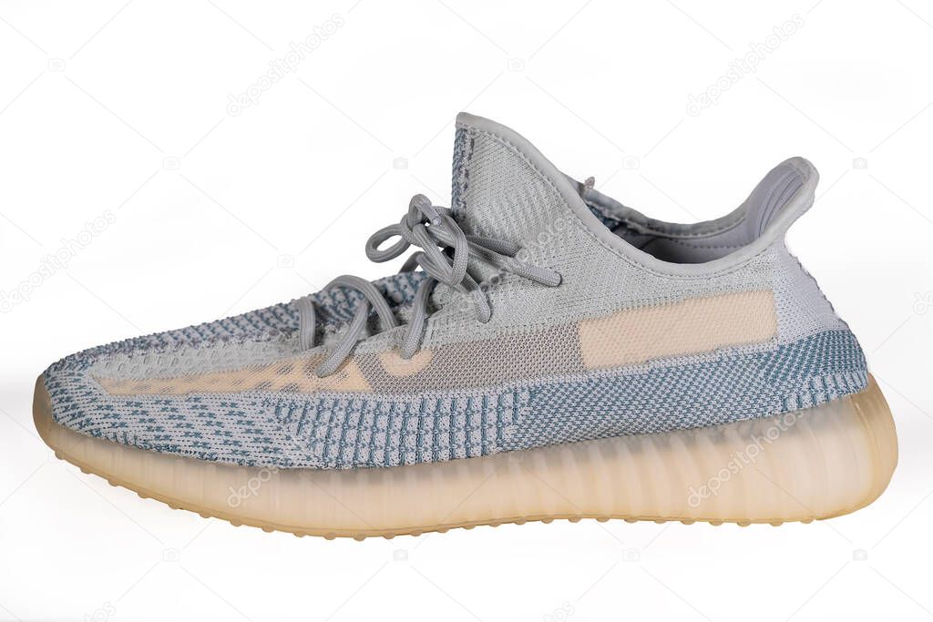 Moscow, Russia - June 2020 : Adidas Yeezy Boost 350 V2 Cloud White - Famous Limited Collection Fashion Sneakers by Kanye West and Adidas Collaboration, Trendy Sport Shoes.