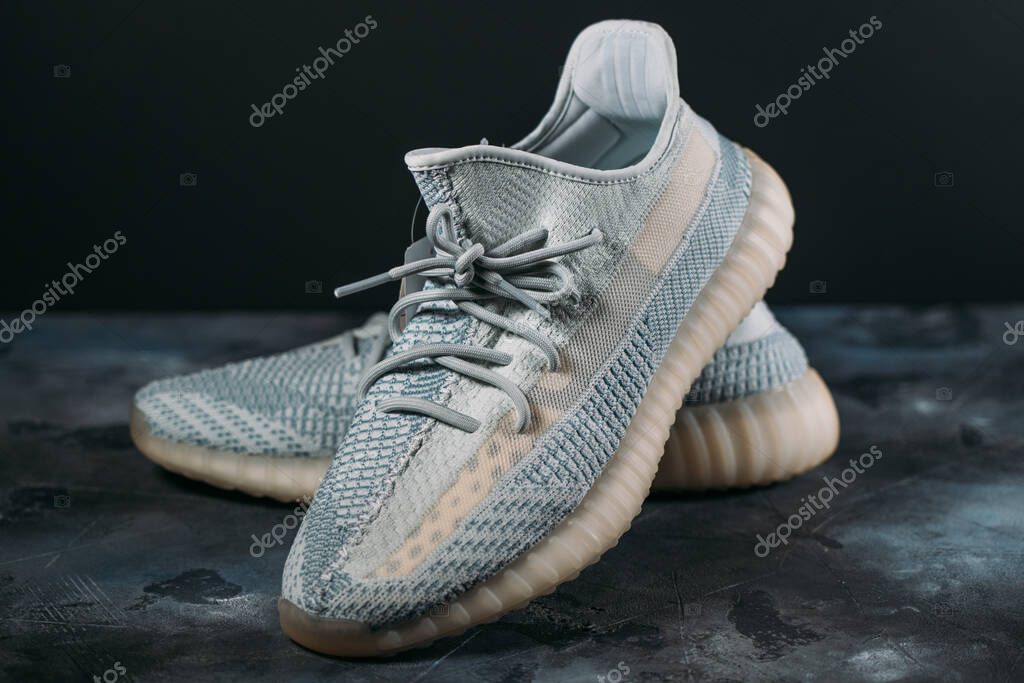 Moscow, Russia - June 2020 : Adidas Yeezy Boost 350 V2 Cloud White - Famous Limited Collection Fashion Sneakers by Kanye West and Adidas Collaboration, Trendy Sport Shoes.