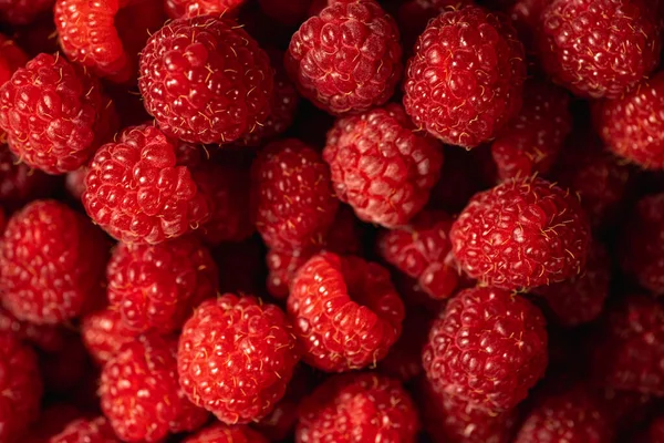 Fresh and sweet organic raspberries background, top view Stock Picture