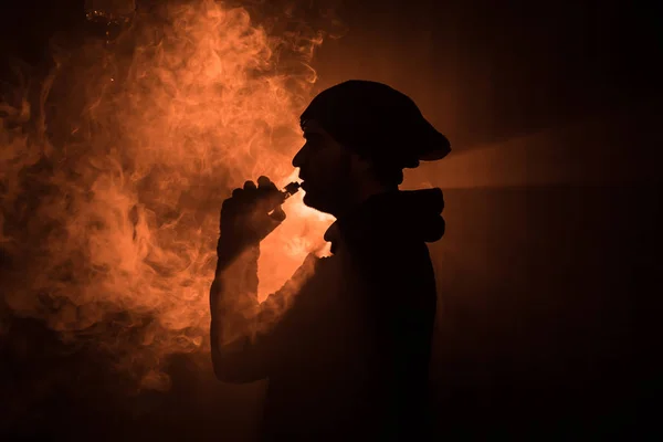 Vaping Man Holding Mod Cloud Vapor Dark Foggy Toned Background — Stock Photo, Image