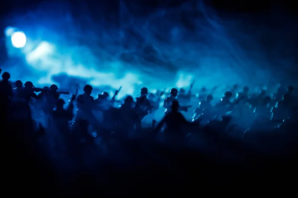 War Concept. Military silhouettes fighting scene on war fog sky background, World War Soldiers Silhouettes Below Cloudy Skyline At night. Attack scene. Armored vehicles. Selective focus. Decoration