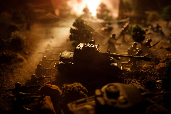 War Concept. Military silhouettes fighting scene on war fog sky background, World War Soldiers Silhouettes Below Cloudy Skyline At night. Attack scene. Armored vehicles. Selective focus. Decoration
