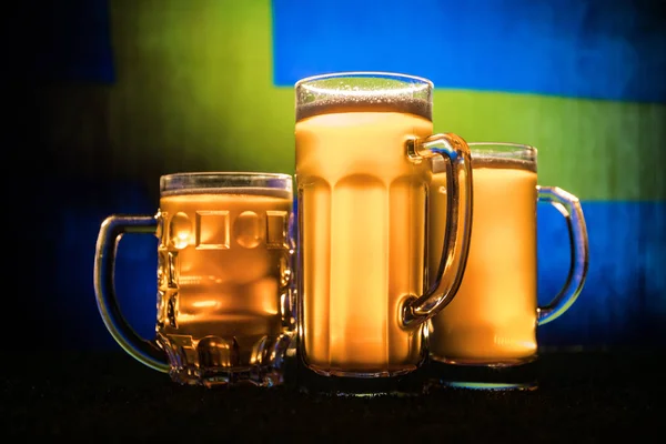 Soccer 2018. Creative concept. Beer glasses on table. Support your country with beer concept. Selective focus