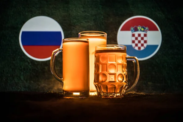 Soccer 2018. Creative concept. Beer glasses with beer on table ready to drink. Support your country with beer concept. Selective focus