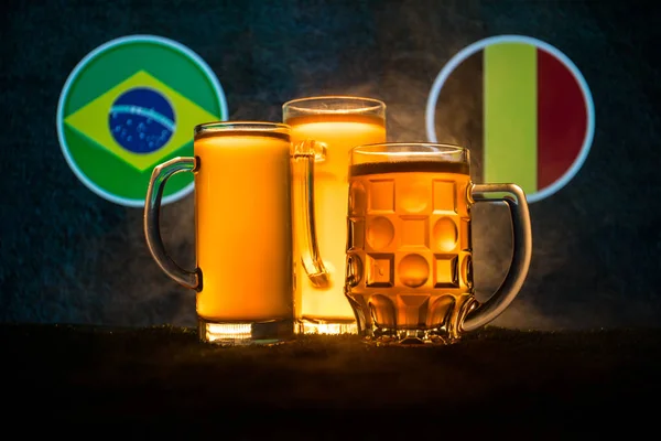 Soccer 2018. Creative concept. Beer glasses with beer on table ready to drink. Support your country with beer concept. Selective focus