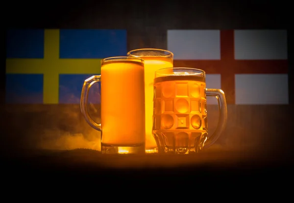 Soccer 2018. Creative concept. Beer glasses with beer on table ready to drink. Support your country with beer concept. Selective focus