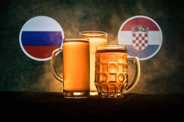 Soccer 2018. Creative concept. Beer glasses with beer on table ready to drink. Support your country with beer concept. Selective focus