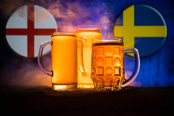 Soccer 2018. Creative concept. Beer glasses with beer on table ready to drink. Support your country with beer concept. Selective focus
