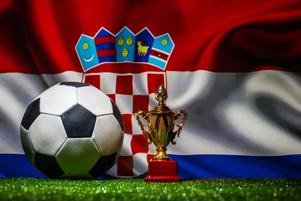 Croatia flag, golden champion\'s cup and soccer ball.Concept sport. Selective focus
