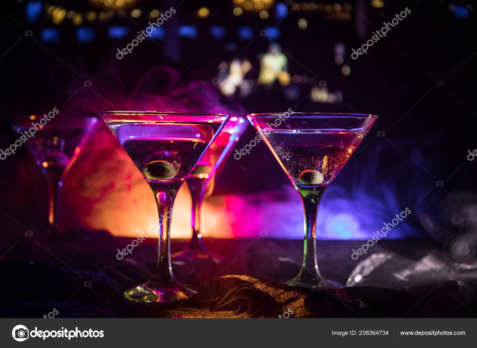 https://st4.depositphotos.com/9904426/20836/i/1600/depositphotos_208364734-stock-photo-several-glasses-famous-cocktail-martini.jpg