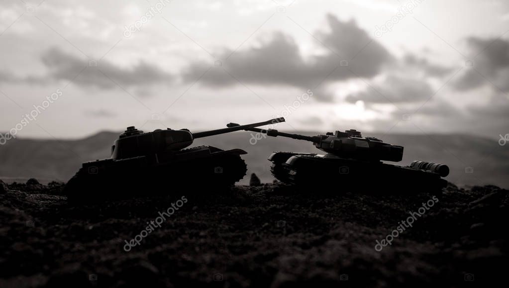 War Concept. Military silhouettes fighting scene on war fog sky background, World War Soldiers Silhouettes Below Cloudy Skyline at sunset. Attack scene. Armored vehicles. tank in action