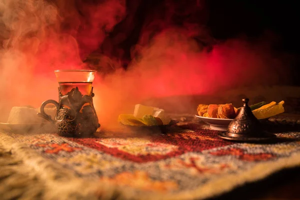 Arabian Tea Glass Eastern Snacks Carpet Dark Background Lights Smoke — Stock Photo, Image