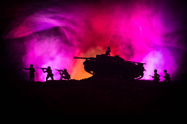 War Concept. Military silhouettes fighting scene on war fog sky background, World War German Tanks Silhouettes Below Cloudy Skyline At night. Attack scene. Armored vehicles. Tanks battle