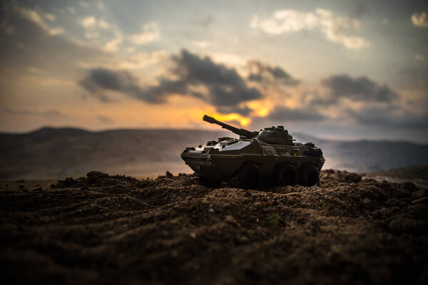 War Concept. Military silhouettes fighting scene on war fog sky background, World War Soldiers Silhouettes Below Cloudy Skyline at sunset. Attack scene. Armored vehicles. tank in action