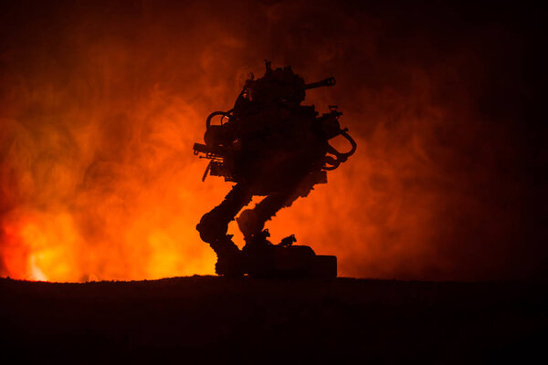 Silhouette of Giant robot. Futuristic tank in action with foggy fire sky background. Combat vehicle.