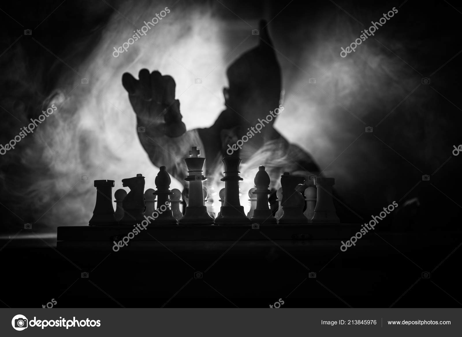 Download A Person Is Playing Chess On A Board Wallpaper