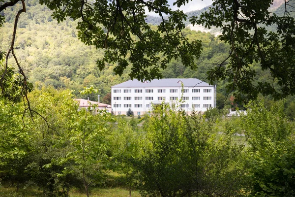 Beautiful landscape of mountains and forest with buildings at summer, Azerbaijan