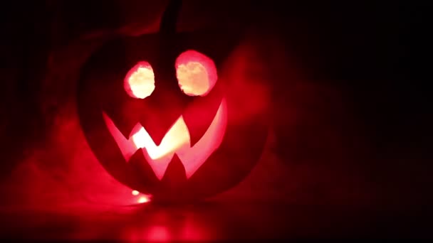 Slider Shot Scary Halloween Pumpkin Carved Eyes Smile Burning Candles — Stock Video