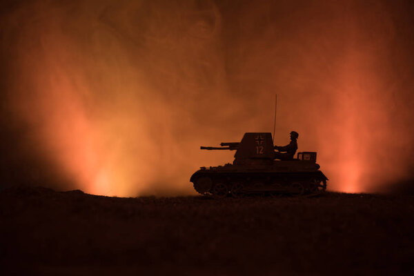 War Concept. Military silhouettes fighting scene on war fog sky background, World War German Tanks Silhouettes Below Cloudy Skyline At night. Attack scene. Armored vehicles. Tanks battle