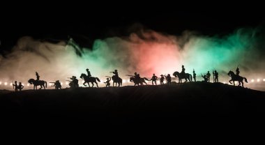 American Civil War Concept. Military silhouettes fighting scene on war fog sky background. Attack scene. Selective focus clipart