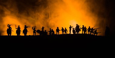 American Civil War Concept. Military silhouettes fighting scene on war fog sky background. Attack scene. Selective focus clipart