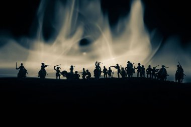 American Civil War Concept. Military silhouettes fighting scene on war fog sky background. Attack scene. Selective focus clipart
