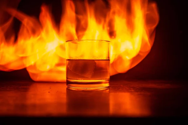 Whiskey Fire Concept Glass Whiskey Ice Wooden Surface Color Light — Stock Photo, Image