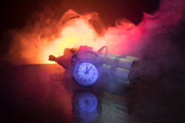 Image of a time bomb against dark background. Timer counting down to detonation illuminated in a shaft light shining through the darkness, conceptual image clipart