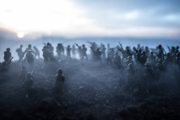 Battle scene. Military silhouettes fighting scene on war fog sky background. World War Soldiers Silhouettes Below Cloudy Skyline At sunset. Artwork Decoration. Selective focus