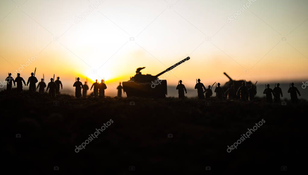 War Concept. Military silhouettes fighting scene on war fog sky background, World War Soldiers Silhouettes Below Cloudy Skyline at sunset. Attack scene. Armored vehicles. tank in action