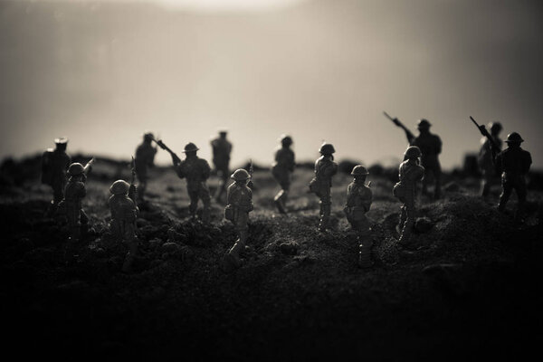 Battle scene. Military silhouettes fighting scene on war fog sky background. World War Soldiers Silhouettes Below Cloudy Skyline At sunset. Artwork Decoration. Selective focus