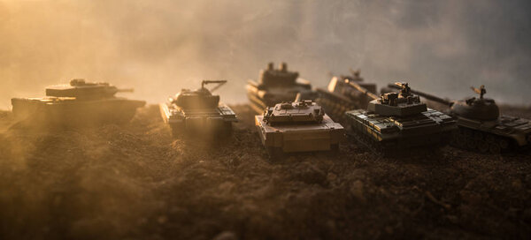War Concept. Military silhouettes fighting scene on war fog sky background, World War Soldiers Silhouettes Below Cloudy Skyline at sunset. Attack scene. Armored vehicles. tank in action
