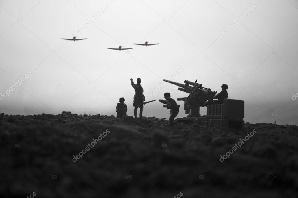 An anti-aircraft cannon and Military silhouettes fighting scene on war fog sky background. Allied air forces attacking on German positions. Artwork decorated scene. Selective focus