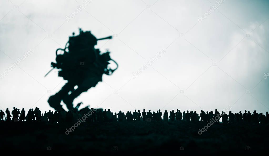 Artwork decoration. Silhouette of giant robot prepare attack crowd at sunset. Horror view of futuristic cyborg going to attack scared people. Selective focus.