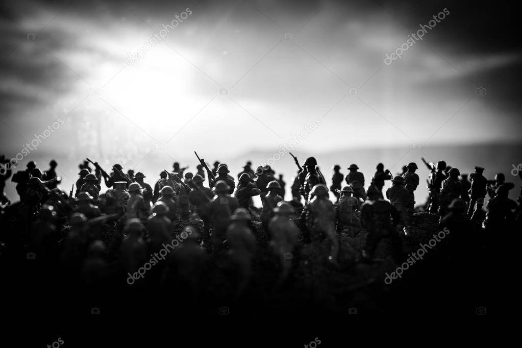 Battle scene. Military silhouettes fighting scene on war fog sky background. World War Soldiers Silhouettes Below Cloudy Skyline At sunset. Artwork Decoration. Selective focus