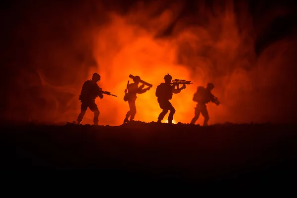 Military soldier silhouette with gun. War Concept. Military silhouettes fighting scene on war fog sky background, World War Soldier Silhouette Below Cloudy Skyline At night. Attack scene