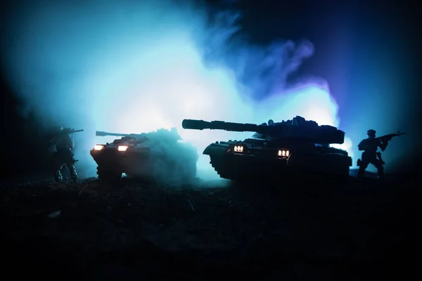 War Concept. Military silhouettes fighting scene on war fog sky background, Silhouette of armored vehicle below Cloudy Skyline At night. Attack scene. Tanks battle. Artwork decoration