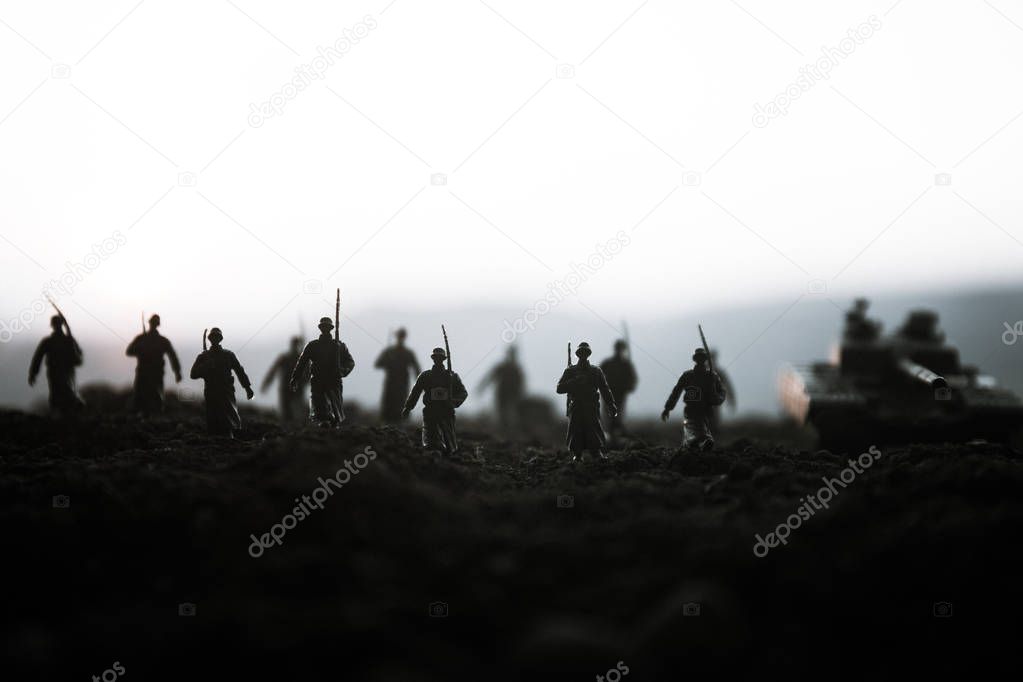 War Concept. Military silhouettes fighting scene on war fog sky background, World War Soldiers Silhouettes Below Cloudy Skyline at sunset. Attack scene. Armored vehicles. tank in action