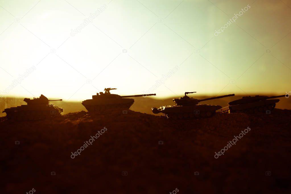 War Concept. Military silhouettes fighting scene on war fog sky background, World War Soldiers Silhouettes Below Cloudy Skyline at sunset. Attack scene. Armored vehicles. tank in action