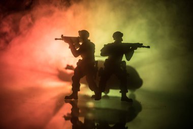 Artwork decoration. Soldiers in the desert during the military operation with combat helicopter or Helicopter assault special forces. Selective focus clipart