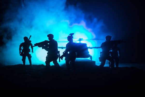 Artwork decoration. Soldiers in the desert during the military operation with combat helicopter or Helicopter assault special forces. Selective focus