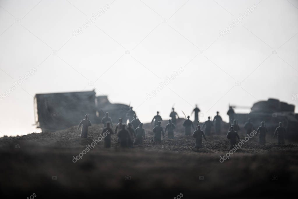 War Concept. Military silhouettes fighting scene on war fog sky background, World War Soldiers Silhouettes below Cloudy Skyline at sunset. Attack scene. Armored vehicles. tank in action