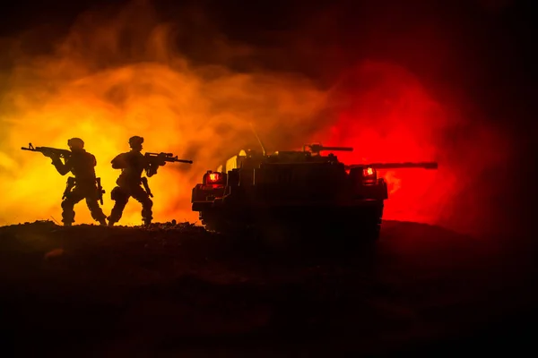 War Concept. Military silhouettes fighting scene on war fog sky background, Silhouette of armored vehicle below Cloudy Skyline At night. Attack scene. Tanks battle. Artwork decoration